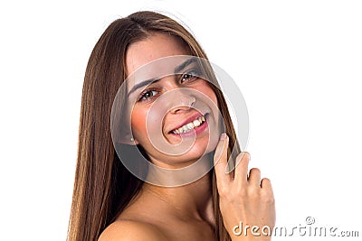 Woman standing sidewise and touching face Stock Photo