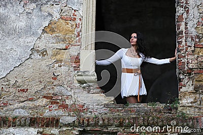 Woman standing in window frame Stock Photo