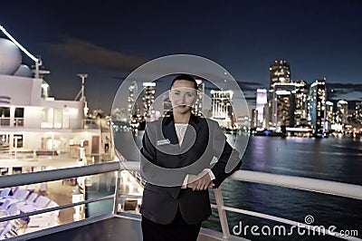 Woman steward on ship board at night in miami, usa. Sensual woman in suit jacket on city skyline. Water transport Stock Photo