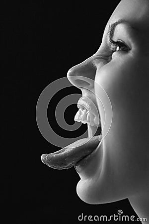 Woman sticking out tongue. Stock Photo