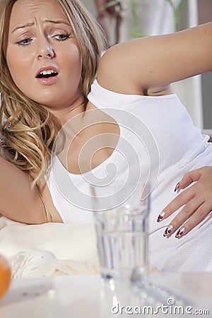 Woman with stomach cramps Stock Photo