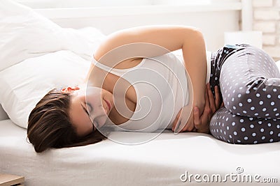 Woman With Stomach Pain Stock Photo