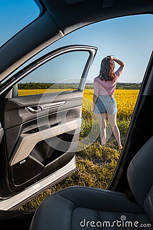woman stop to enjoy sunset at road trip Stock Photo