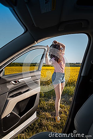 woman stop to enjoy sunset at road trip Stock Photo
