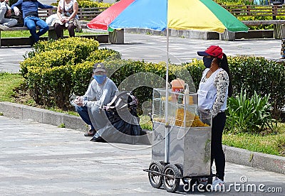 Woman street food seller wearing mask, Ecuador Editorial Stock Photo