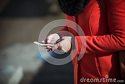 Woman in the street texting with her mobile Stock Photo
