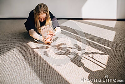 Woman stretching and getting ready for her yoga class. Stock Photo