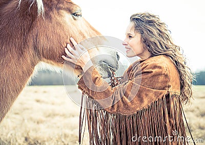 Woman stroking horse Stock Photo