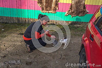 Woman stroking a rabbit. Nature love and vegan concept Stock Photo