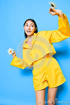 woman studio chamomile blue happiness portrait young smile model flower yellow Stock Photo