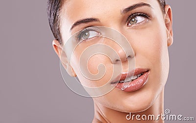 Woman, studio and idea with beauty, cosmetics and gloss for makeup and glamour appeal in face zoom. Female person Stock Photo