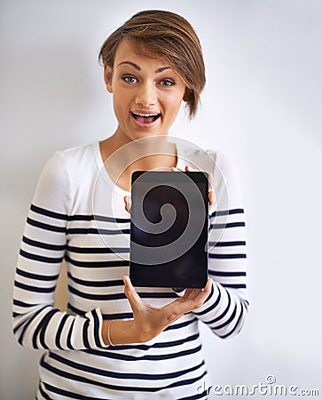 Woman, studio or portrait with tablet, screen and wow for social media or communication. Girl, mockup and smile with Stock Photo