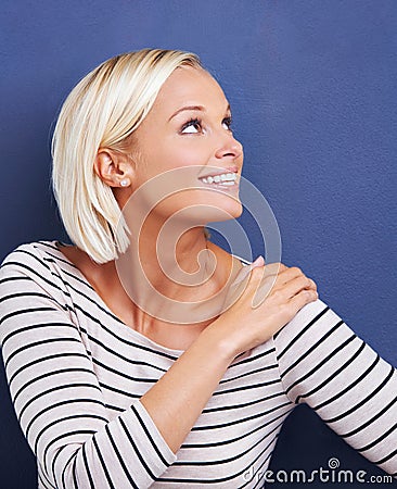 Woman, studio and space for mockup, smile and happiness for confidence. Girl, thinking and vision for fashion, design Stock Photo