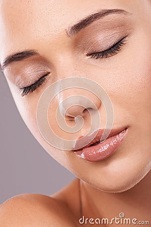 Woman, studio and thinking with dreaming, cosmetics and gloss for makeup and glamour appeal in face zoom. Female person Stock Photo