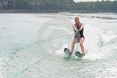 Woman study waterskiing on lake Stock Photo