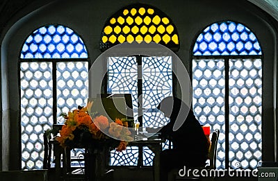 Woman studying Koran Editorial Stock Photo