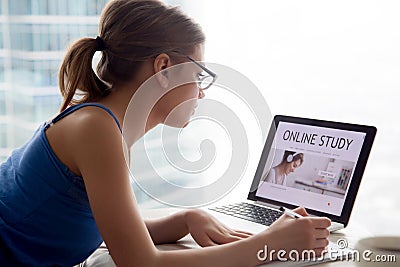 Woman studying online educational course on internet using lapto Stock Photo