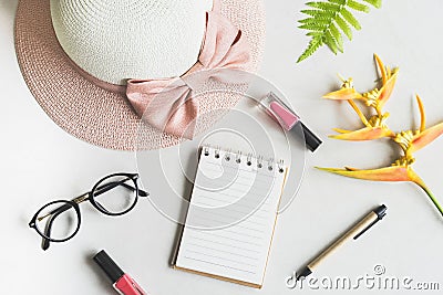 Woman stuff, makeup, flower with empty notepad Stock Photo