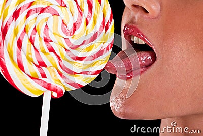 Woman sucking cute sweet candy Stock Photo