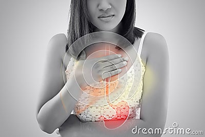 Woman suffering from Acid reflux or Heartburn Stock Photo