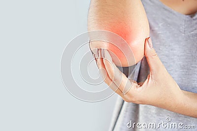 Woman suffering from elbow pain and injury concept Stock Photo