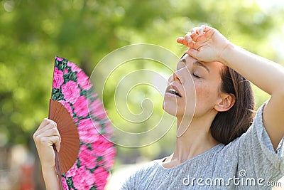 Woman suffering a heat stroke in a warm summer day Stock Photo