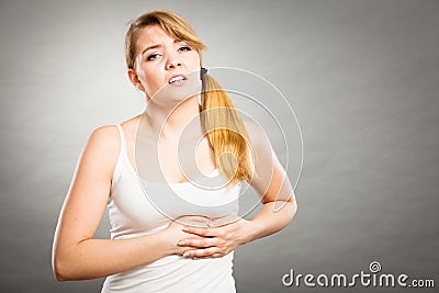 Woman suffering from sharp chest pain Stock Photo
