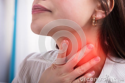 Woman Suffering From Sore Throat Stock Photo