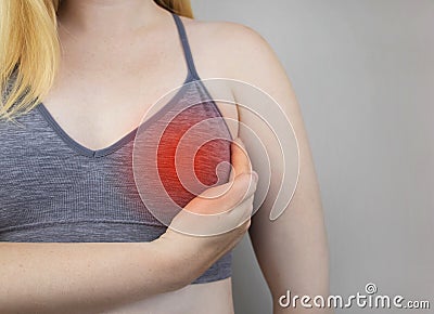 A woman suffers from chest pain. On examination by a gynecologist-mammologist. The concept of the prevention of breast diseases, Stock Photo