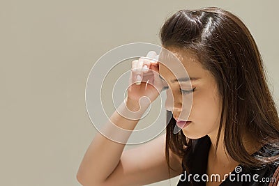 Woman suffers from headache, fatigue Stock Photo