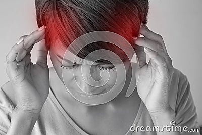 Woman suffers from pain, headache, sickness, migraine, stress Stock Photo