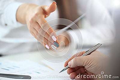 Woman in suit give hand as hello in office closeup Stock Photo