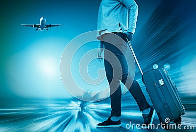 Woman with suitcase awaiting aircraft Stock Photo