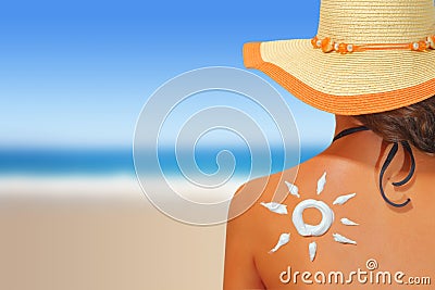 Woman with sun shaped sunscreen Stock Photo