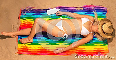 Woman sunbathing in bikini with straw hat Stock Photo