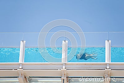 A woman swim in the rooftop swimming pool of her hotel in Magaluf in Mallorca Editorial Stock Photo