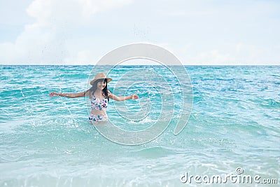 Woman with swimsuit swim in the sea Joyfully, happiness Stock Photo
