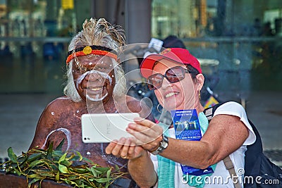 Woman takes selfie with Australian Aborigine Editorial Stock Photo