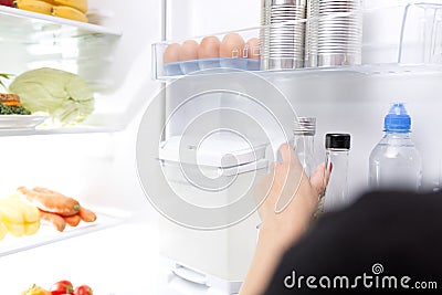 Woman taking a glass bottle Stock Photo