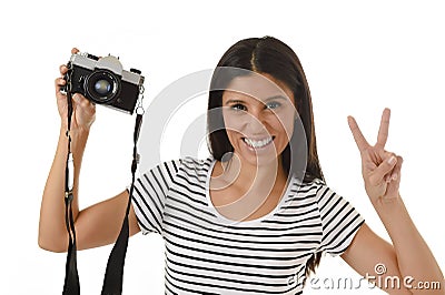 Woman taking pictures posing smiling happy using cool retro and vintage photo camera Stock Photo