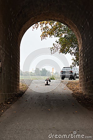 Woman taking pictures through a tunnel Editorial Stock Photo