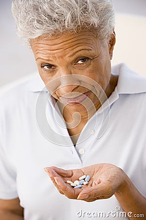 Woman Taking Pills Stock Photo
