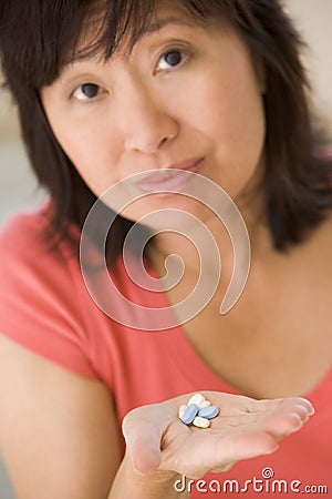 Woman Taking Pills Stock Photo