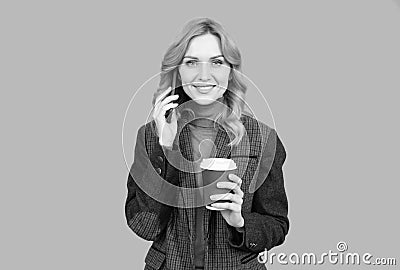 Woman talk on phone drinking coffee. Caffeine and smartphone addiction. Addiction to technology Stock Photo