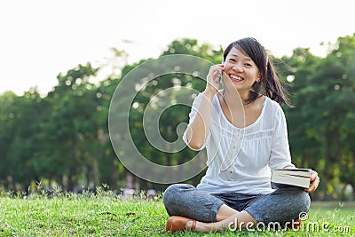 Woman talking on mobile phone and smiling Stock Photo