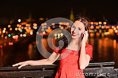 Woman talks on mobile telephone Stock Photo