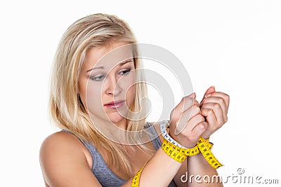 Woman with tape measure before the next diet Stock Photo