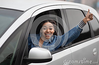 Woman taxi driver and great mood on active work Stock Photo