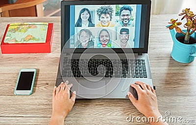 Woman teacher having a video call with multiracial students during isolation quarantine - Group of people chatting online - Stock Photo