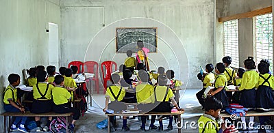 A woman teacher teaching classroom full of children Editorial Stock Photo